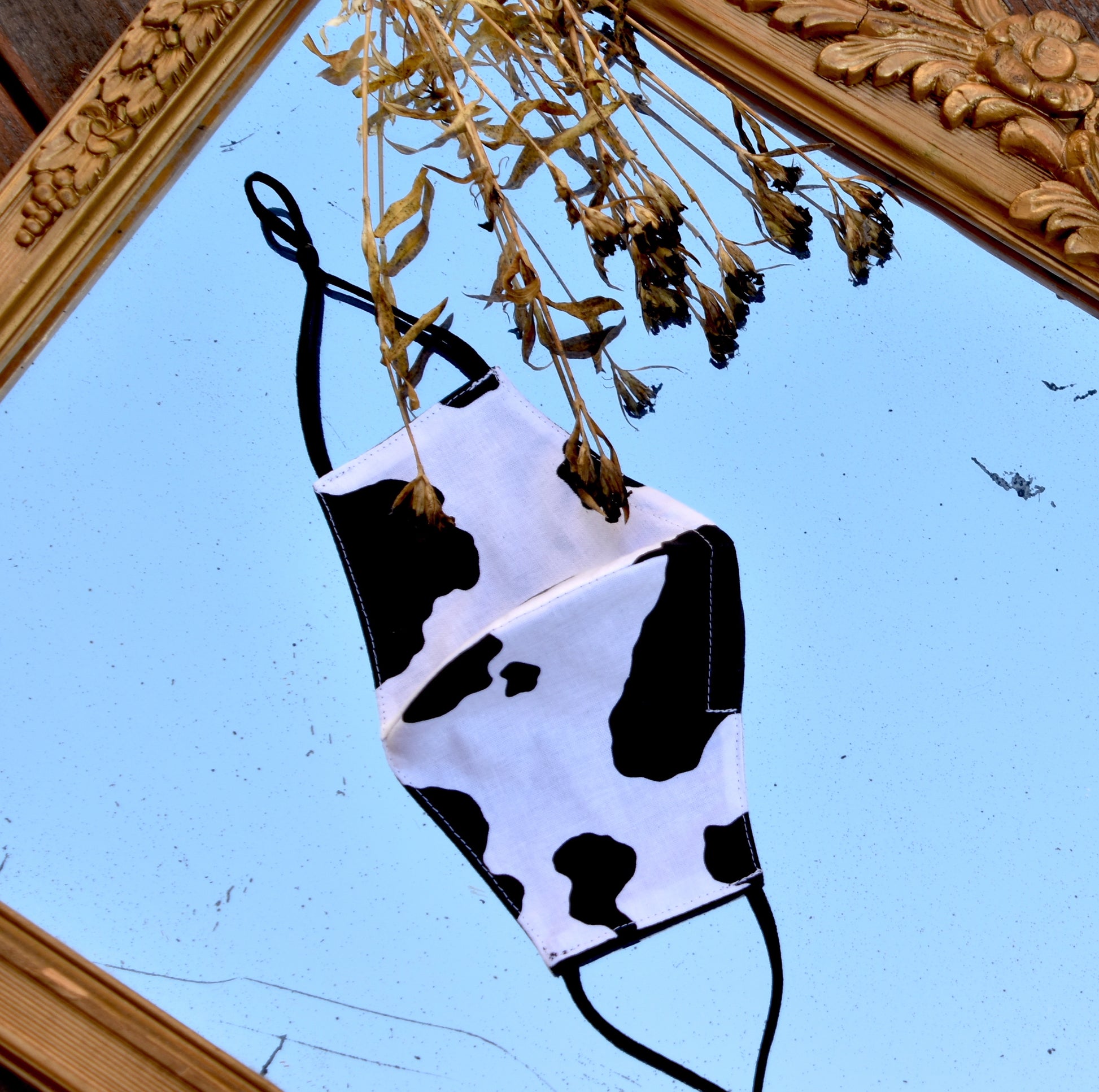 Unique and elegant, our stunning cow print masks are sure to cause an impact wherever they go. Available in full print and color blocked styles.  Reversible and double-layered. Built for comfort with an adjustable nose bridge and adjustable ear straps. 