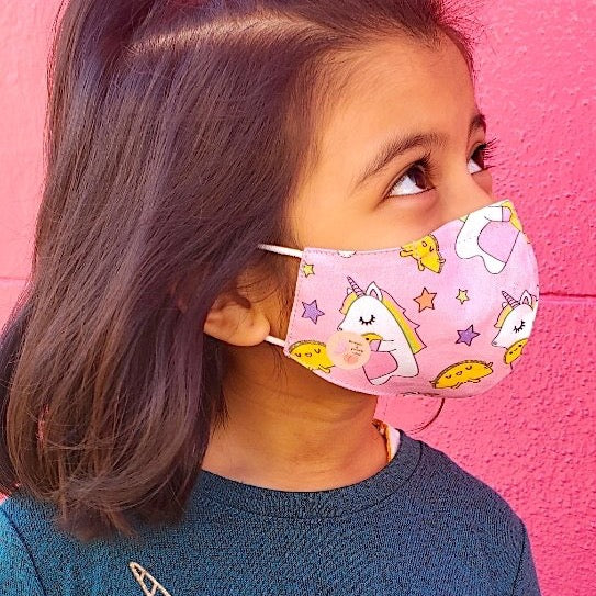 This unicorns and tacos print cotton face mask is reversible and double-layered, built for comfort with an adjustable nose bridge and adjustable ear straps. 